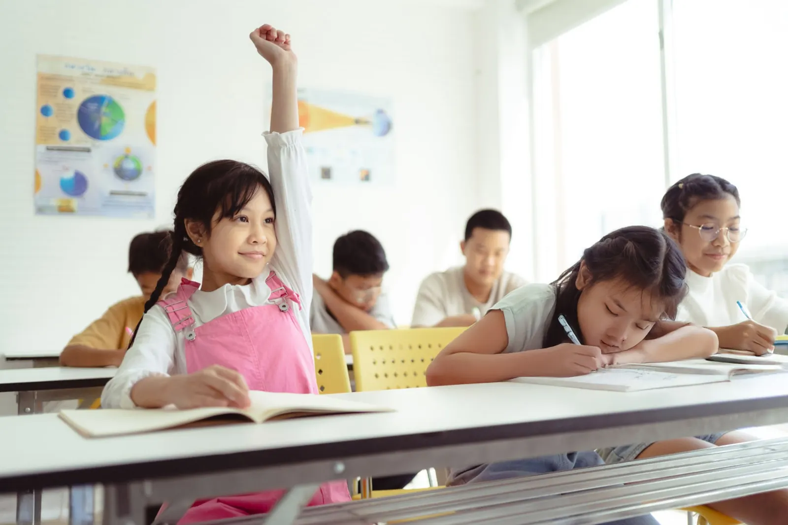 Students learning in a bright classroom